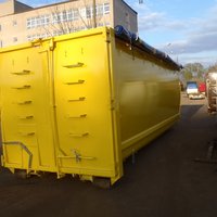 Abrollcontainer mit 36 m³ Volumen aus der Serie EKO2, gelb lackiert mit Rollplane und integriertem Kornschieber